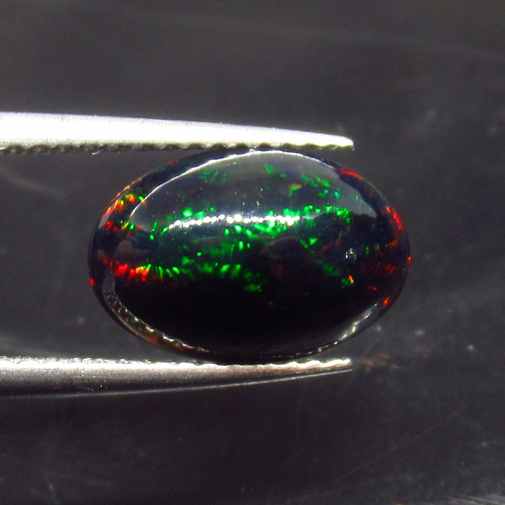 1.68 Ct Natural Ethiopian Black Fire Opal Oval Cab: No Reserve! Title: 1.68 Ct Natural Ethiopian Black Fire Opal Oval Cab Stone Clarity: Translucent Gemstones: Natural Black Opal Carat Weights: 1.68 Size/Dimensions: 11.70 x 7.90 x 4.40 mm Additional In