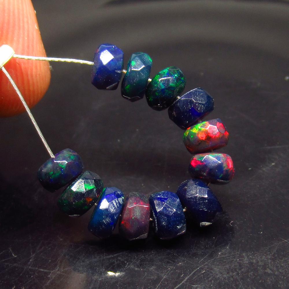 4.40 Ct Natural 12 Drilled Faceted Black Fire Opal: No Reserve! Title: 4.40 Ct Natural 12 Drilled Faceted Black Fire Opal Beads Stone Clarity: Translucent Gemstones: Natural Black Opal Beads Carat Weights: 4.4 Size/Dimensions: 4.50 to 5.20 mm / 12 PC's