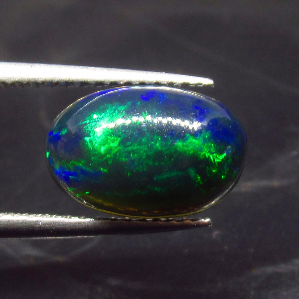 1.84 Ct Natural Ethiopian Black Fire Opal Oval Cab: No Reserve! Title: 1.84 Ct Natural Ethiopian Black Fire Opal Oval Cab Stone Clarity: Translucent Gemstones: Natural Black Opal Carat Weights: 1.84 Size/Dimensions: 11.90 x 7.90 x 4.20 mm Additional In