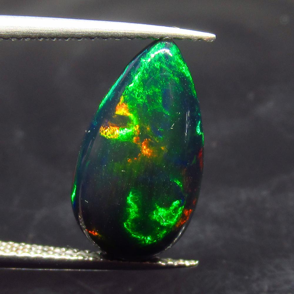 3.37 Ct Natural Ethiopian Black Fire Opal Pear Cab: No Reserve! Title: 3.37 Ct Natural Ethiopian Black Fire Opal Pear Cab Stone Clarity: Translucent Gemstones: Natural Black Opal Carat Weights: 3.37 Size/Dimensions: 16.00 x 9.20 x 5.00 mm Additional In