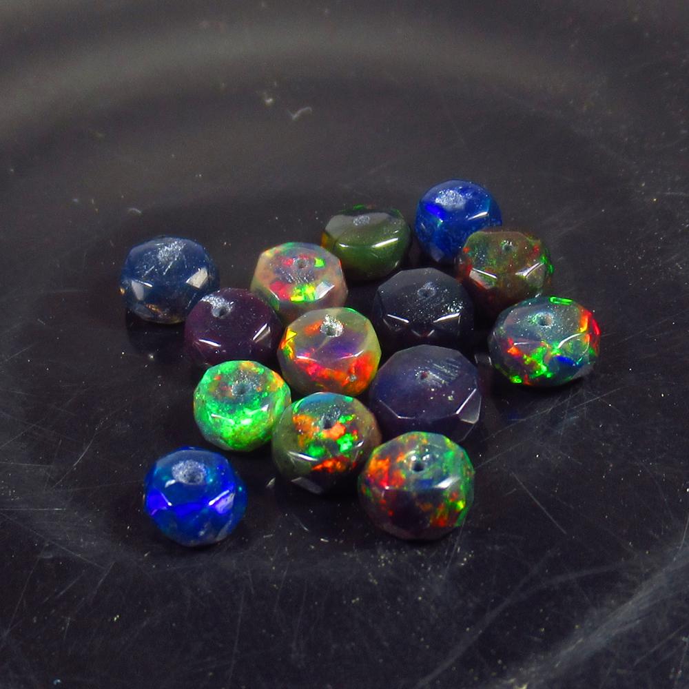 3.73 Ct Natural 14 Drilled Faceted Black Fire Opal: No Reserve! Title: 3.73 Ct Natural 14 Drilled Faceted Black Fire Opal Beads Stone Clarity: Translucent Gemstones: Natural Black Opal Beads Carat Weights: 3.73 Size/Dimensions: 4.10 to 4.70 mm / 14 PC'
