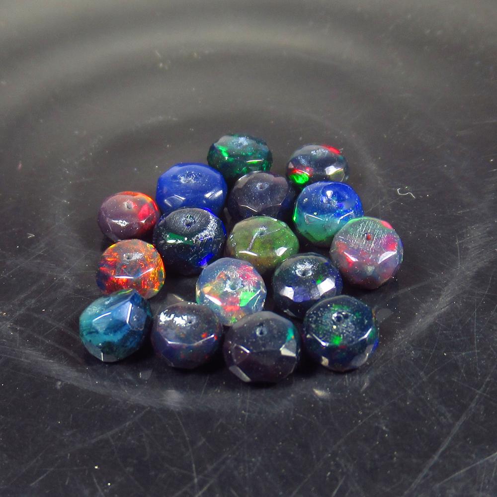 6.61 Ct Natural 16 Drilled Faceted Black Fire Opal: No Reserve! Title: 6.61 Ct Natural 16 Drilled Faceted Black Fire Opal Beads Stone Clarity: Translucent Gemstones: Natural Black Opal Beads Carat Weights: 6.61 Size/Dimensions: 4.40 to 5.30 mm / 16 PC'
