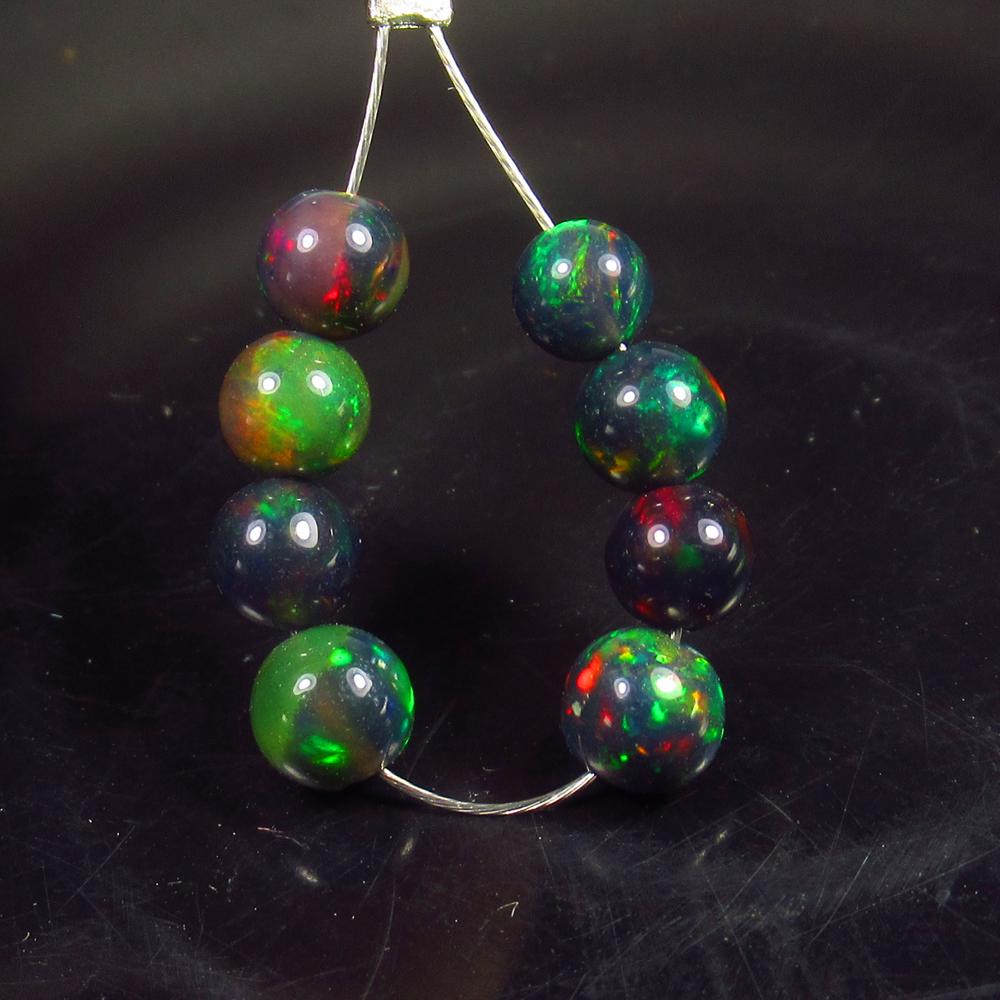 3.30 Ct Natural 8 Drilled Black Fire Opal Ball Beads: No Reserve! Title: 3.30 Ct Natural 8 Drilled Black Fire Opal Ball Beads Stone Clarity: Translucent Gemstones: Natural Black Opal Beads Carat Weights: 3.3 Size/Dimensions: 4.20 to 4.80 mm / 8 PC's Addi