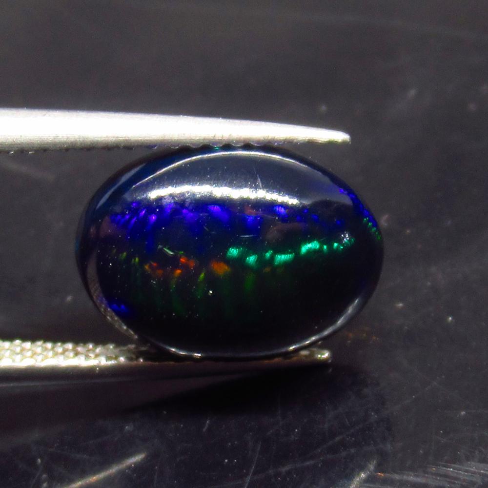 3.05 Ct Natural Ethiopian Black Fire Opal Oval Cab: No Reserve! Title: 3.05 Ct Natural Ethiopian Black Fire Opal Oval Cab Stone Clarity: Translucent Gemstones: Natural Black Opal Carat Weights: 3.05 Size/Dimensions: 12.50 x 9.10 x 5.20 mm Additional In