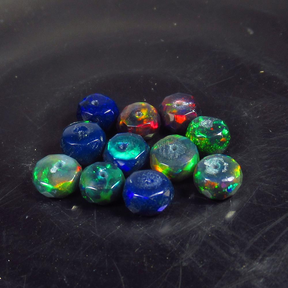 4.46 Ct Natural 11 Drilled Faceted Black Fire Opal: No Reserve! Title: 4.46 Ct Natural 11 Drilled Faceted Black Fire Opal Beads Stone Clarity: Translucent Gemstones: Natural Black Opal Beads Carat Weights: 4.46 Size/Dimensions: 4.90 to 5.20 mm / 11 PC'