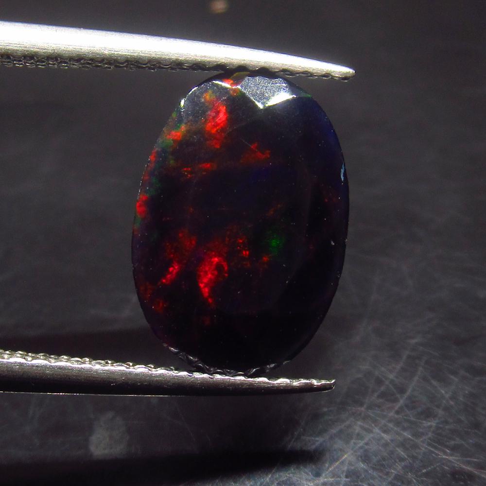 1.72 Ct Natural Ethiopian Black Fire Opal Oval Cut: No Reserve! Title: 1.72 Ct Natural Ethiopian Black Fire Opal Oval Cut Stone Clarity: Translucent Gemstones: Natural Black Opal Carat Weights: 1.72 Size/Dimensions: 12.00 x 8.40 x 4.10 mm Additional In