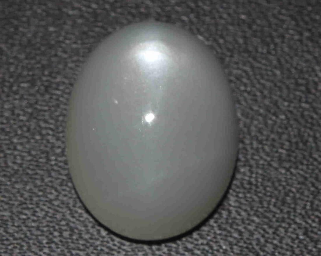 14.70 Cts Natural Moonstone: No Reserve! Title: 14.70 Cts Natural Moonstone Additional Information: Gemstone : Natural Moonstone Shape : Oval Cabochon Weight : 14.70 Carats Measurements : 16.6x13x9.2 mm Color : White Transparency