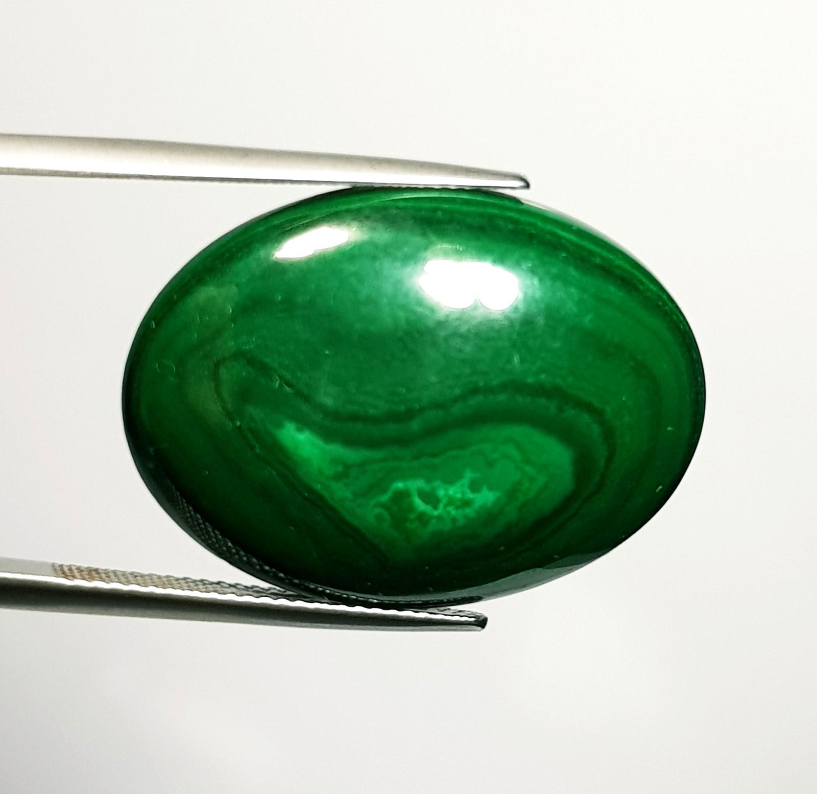 44.24 ct Natural Malachite: No Reserve! Title: 44.24 ct Natural Malachite Color/Clarity: Opaque Carat Weight: 44.24 Size/Dimensions: 29.90 x 12.35 x 6.40 Additional Information: Oval - USA/Egypt Shipping: Domestic: Flat-rate of