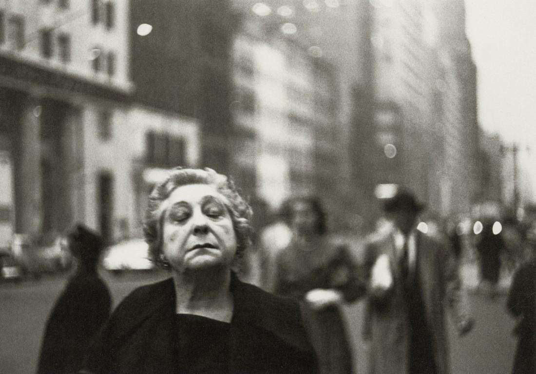 DIANE ARBUS - Woman on Street with Eyes Closed, 1956: Artist: Diane Arbus Title: Woman on the Street with Her Eyes Closed, N.Y.C. 1956 Medium: Photo Litho, 2003, Germany Dimensions: 8.15x5.7" Description: Heat Wax Mounted on 8.5x11" Conservation Board Ar