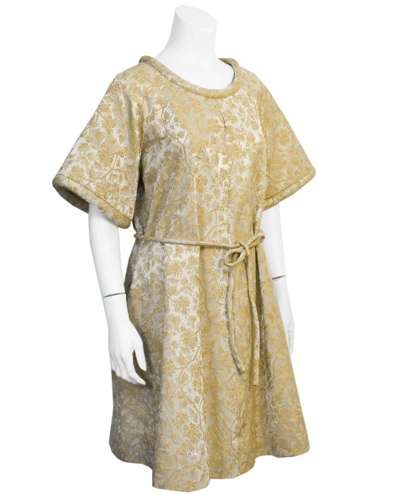 Anonymous Gold Brocade Jacquard Swing Hostess Dress: Made in Montreal between 50's and 60's. An amazing hostess piece that Audrey Hepburn would have paired with skinny black pants and a ballet flat for at home entertaining. Everyone has black skinny's a