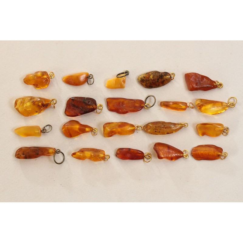 Baltic amber stones pendants with loops 25g: 100% natural Baltic amber stones pendants with loops. 20 pieces. Total weight: 25 gram (0.88 oz) Beads size: about 8-15 mm Stone: 100% natural Baltic amber Treatment: no Condition: as on the photo (go