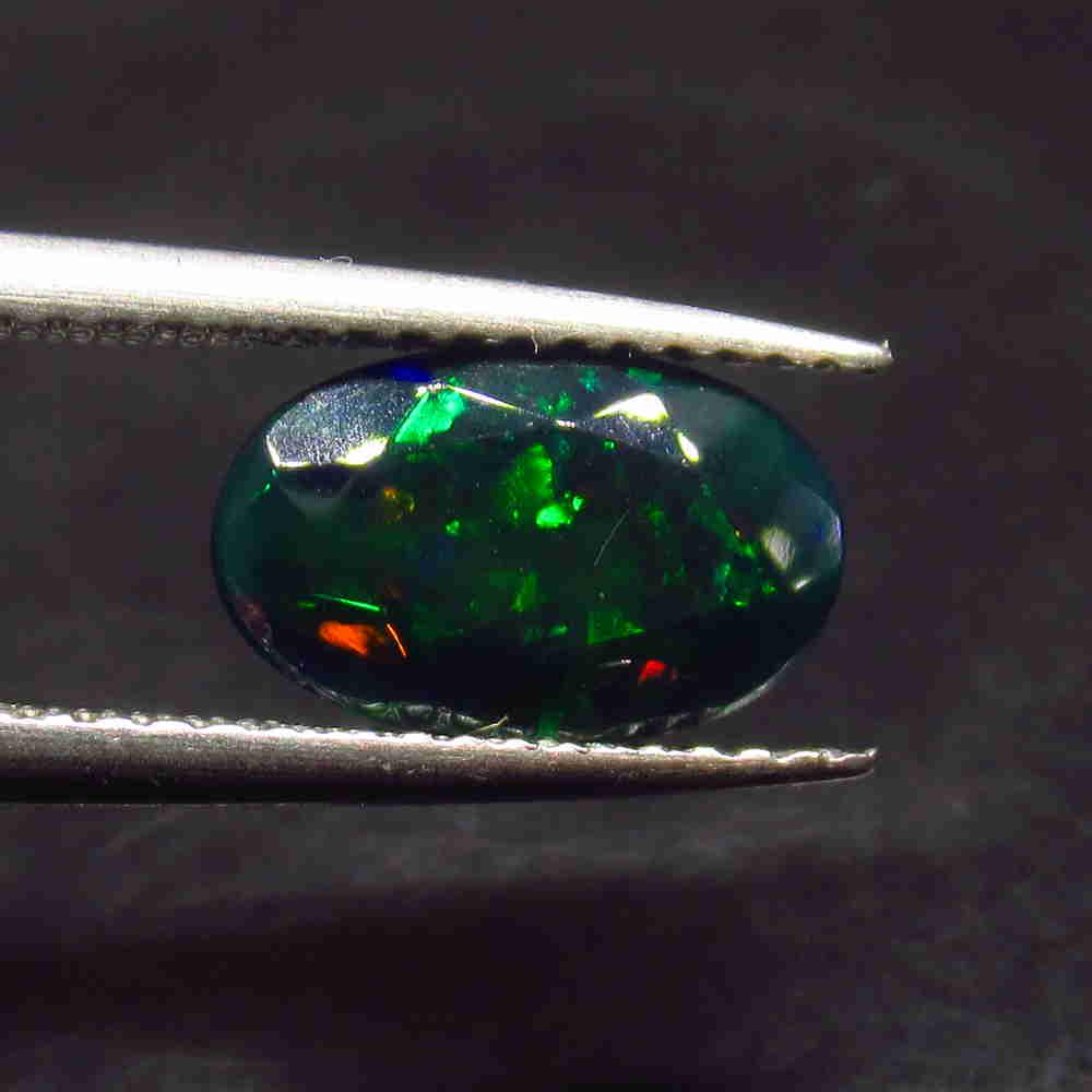 1.41 Ctw Natural Ethiopian Black Fire Opal Oval Cut: No Reserve! Title: 1.41 Ctw Natural Ethiopian Black Fire Opal Oval Cut Stone Clarity: Translucent Gemstone: Black Opal Carat Weight: 1.41 Size/Dimensions: 10.40 x 6.40 x 4.80 mm Additional Information