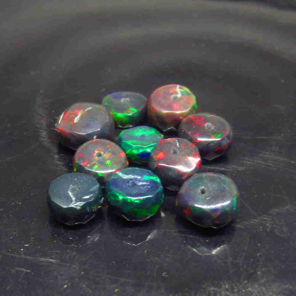 9.06 Ctw Natural 10 Drilled Faceted Black Opal Beads: No Reserve! Title: 9.06 Ctw Natural 10 Drilled Faceted Black Opal Beads Stone Clarity: Translucent Gemstone: Faceted Black Opal Beads Carat Weight: 9.06 Size/Dimensions: 6.20 to 7.00 mm / 10 PC's Addi