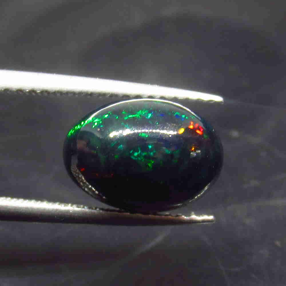 2.18 Ctw Natural Ethiopian Black Fire Opal Oval Cab: No Reserve! Title: 2.18 Ctw Natural Ethiopian Black Fire Opal Oval Cab Stone Clarity: Translucent Gemstone: Black Opal Carat Weight: 2.18 Size/Dimensions: 11.00 x 8.00 x 6.20 mm Additional Information
