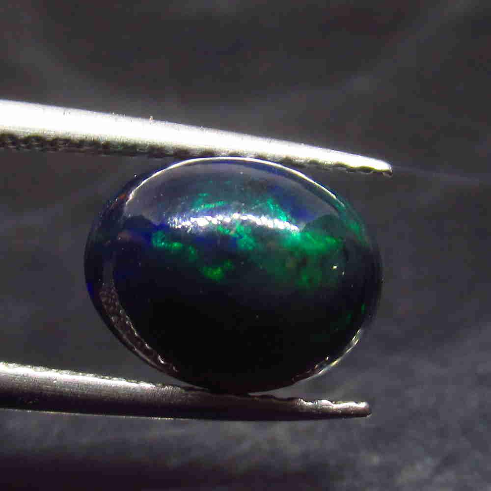 1.77 Ctw Natural Ethiopian Black Fire Opal Oval Cab: No Reserve! Title: 1.77 Ctw Natural Ethiopian Black Fire Opal Oval Cab Stone Clarity: Translucent Gemstone: Black Opal Carat Weight: 1.77 Size/Dimensions: 9.50 x 7.50 x 5.50 mm Additional Information: