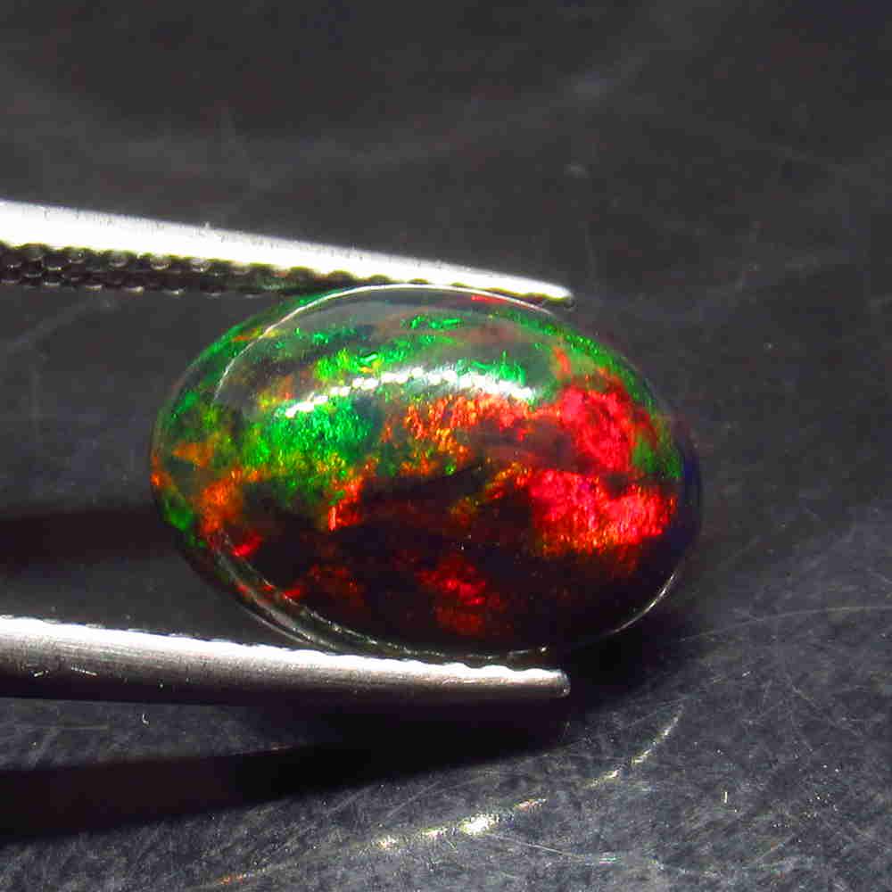 2.19 Ctw Natural Ethiopian Black Fire Opal Oval Cab: No Reserve! Title: 2.19 Ctw Natural Ethiopian Black Fire Opal Oval Cab Stone Clarity: Translucent Gemstone: Black Opal Carat Weight: 2.19 Size/Dimensions: 11.60 x 8.20 x 5.50 mm Additional Information