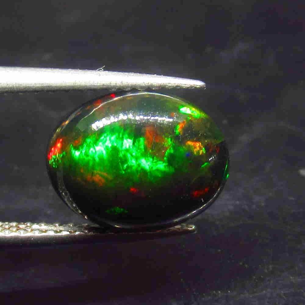1.94 Ctw Natural Ethiopian Black Fire Opal Oval Cab: No Reserve! Title: 1.94 Ctw Natural Ethiopian Black Fire Opal Oval Cab Stone Clarity: Translucent Gemstone: Black Opal Carat Weight: 1.94 Size/Dimensions: 10.70 x 8.50 x 4.30 mm Additional Information