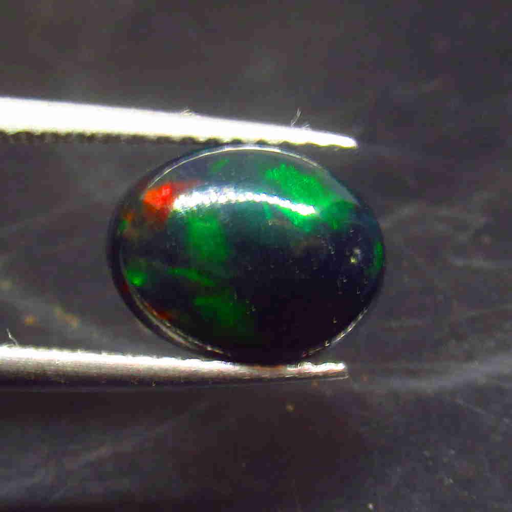 1.29 Ctw Natural Ethiopian Black Fire Opal Oval Cut: No Reserve! Title: 1.29 Ctw Natural Ethiopian Black Fire Opal Oval Cut Stone Clarity: Translucent Gemstone: Black Opal Carat Weight: 1.29 Size/Dimensions: 9.70 x 7.50 x 4.20 mm Additional Information: