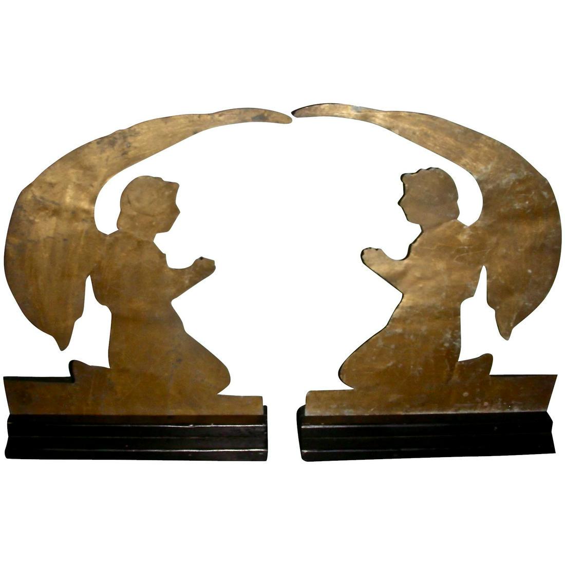 Pr Sheet Tin Masonic Archangels, Early 20th C: A pair of early 20th century Sheet Tin Archangels from a Masonic Temple. The angels are painted gold (both sides) and measures 13 ½" across at the base and 17 ½" tall from the base to the to
