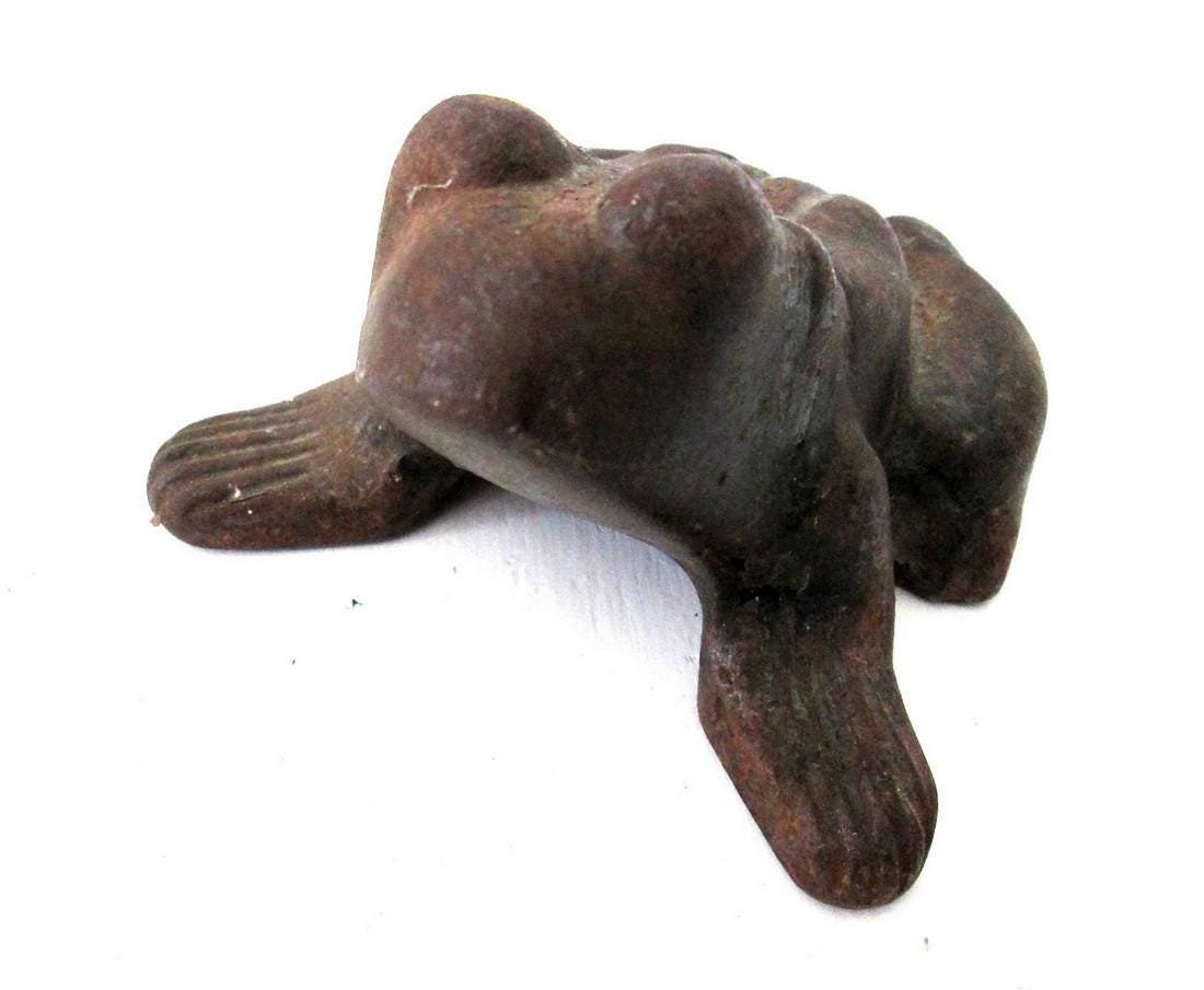 Bullfrog Doorstop: Title: Bullfrog Doorstop Date/Period: C 1920 Dimension: 3"H X 5"W X 4 1/2"D Materials: Cast Iron Additional Information: Chunky graphic form, great patina, worn lightly oxidized original painted surfa