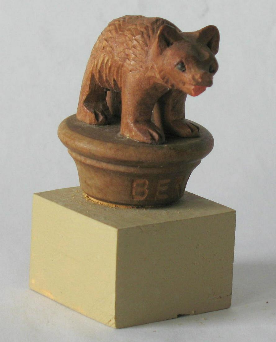 Folk art wood carving of a bear (1 of 3)
