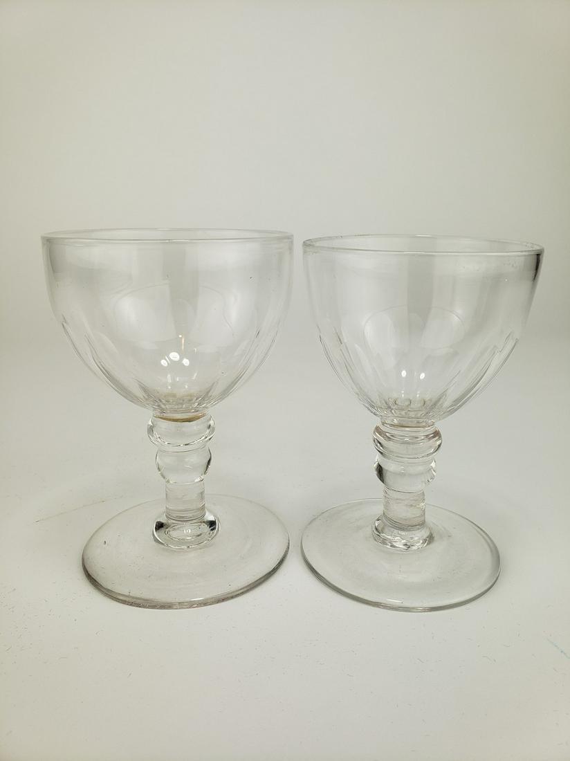 Near Pair Georgian Wine Glasses: Title: Near Pair Georgian Wine Glasses Date/Period: late 18th to mid 19th century Dimension: 4 3/4" x 3" Materials: blown glass Additional Information: Almost identical but with some height and diamet