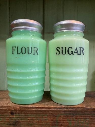 4.75" JADEITE JEANETTE RIBBED BEEHIVE FLOUR AND SUGAR: Title: 4.75" JADEITE JEANETTE RIBBED BEEHIVE FLOUR AND SUGAR SHAKERS Provenance/Additional Info: GLOWING 4.75" JADEITE FLOUR AND SUGAR SHAKERS Date/Period: APPROX 1930-40'S Materials: GLASS Dimensions
