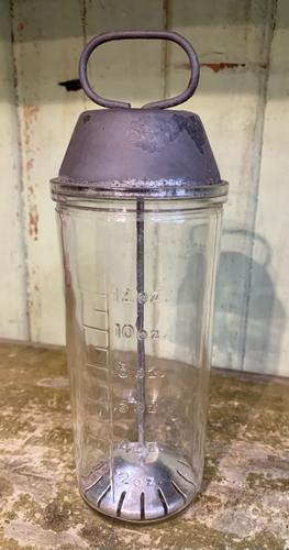 1940'S NATIONAL DAIRY GLASS MALTED MILK MIXER WITH TIN: Title: 1940'S NATIONAL DAIRY GLASS MALTED MILK MIXER WITH TIN TOP Provenance/Additional Info: VINTAGE NATIONAL DAIRY GLASS MALTED MILK MIXER WITH TIN TOP CIRCA 1940S 9" TALL Date/Period: APPROX 1940'S