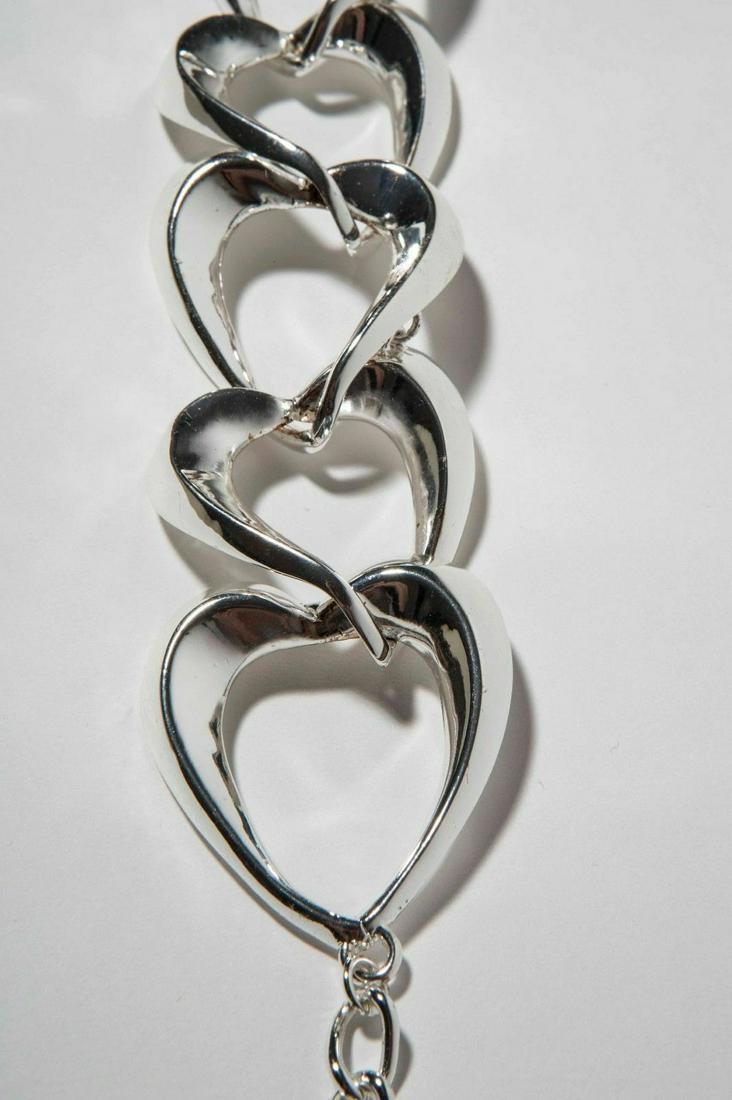 Robert Lee Morris Silver Plated Heart Shaped Necklace: Sweet and sassy statement necklace.... Silver plated over base metal.... Made in the 1990s..... Necklace measures 16" in length... Tag reads "Robert Lee Morris"... Closes with jump ring and t bar clas