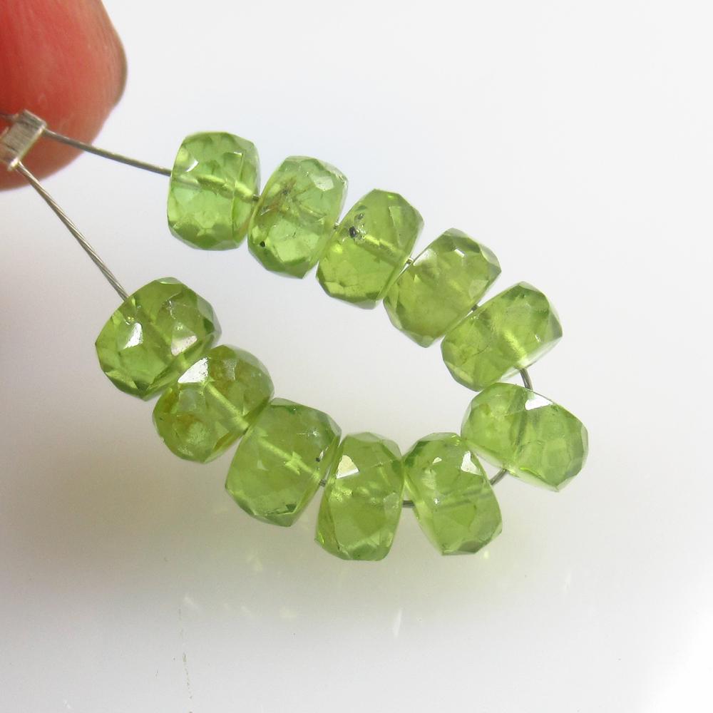 10.41 Ct Natural 11 Drilled Pakistan Peridot Round: No Reserve! Title: 10.41 Ct Natural 11 Drilled Pakistan Peridot Round Beads Stone Clarity: VVS Gemstone: Natural Peridot Beads Carat Weight: 10.41 Size/Dimensions: 5.10 - 5.50 mm / 11 PC's Additional 