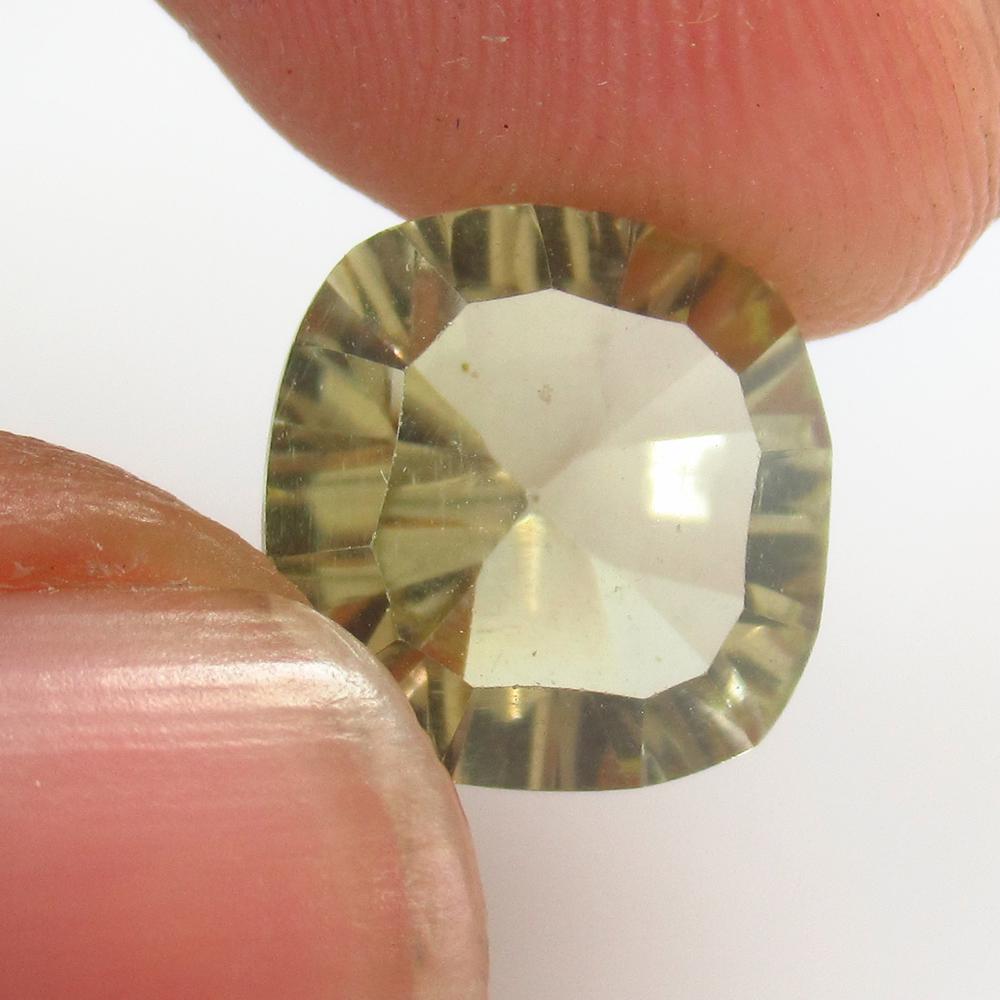 5.11 Ct Natural Lemon Quartz Concave Cut: No Reserve! Title: 5.11 Ct Natural Lemon Quartz Concave Cut Stone Clarity: VVS Gemstone: Natural Lemon Quartz Carat Weight: 5.11 Size/Dimensions: 11.00 x 10.80 x 7.20 mm Additional Information: Good L