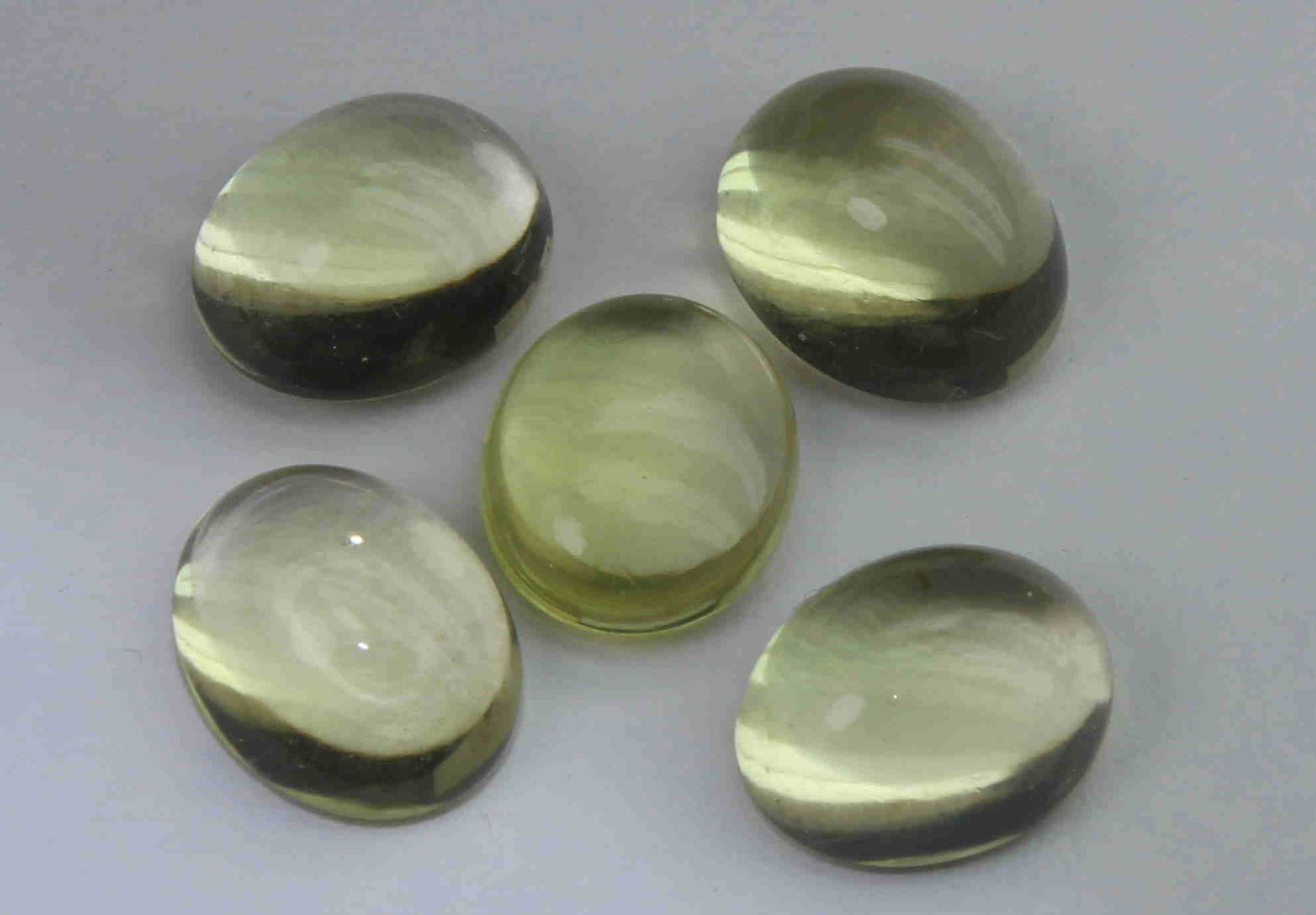 13.91 Cts Natural Lemon Quartz Lot: No Reserve! Title: 13.91 Cts Natural Lemon Quartz Lot Description: Gemstone : Natural Lemon Quartz Weight : 13.91 Carats Dimensions : 10x8 mm [Calibrated] Shape : Oval Cabochon Number of Stone : 5 Col