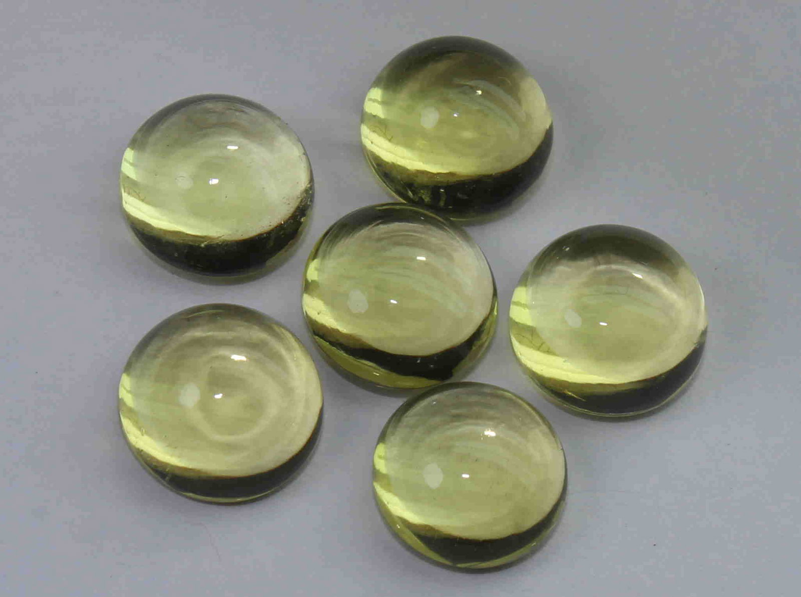 12.03 Cts Natural Lemon Quartz Lot: No Reserve! Title: 12.03 Cts Natural Lemon Quartz Lot Description: Gemstone : Natural Lemon Quartz Weight : 12.03 Carats Dimensions : 8-8 mm [Calibrated] Shape : Round Cabochon Number of Stone : 3 Col