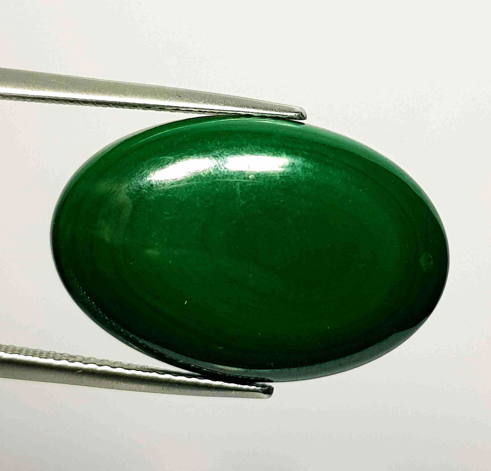 29.73 ct Natural Malachite: No Reserve! Title: 29.73 ct Natural Malachite Color/Clarity: Opaque Gemstones: Loosegemstone Carat Weights: 29.73 Size/Dimensions: 25.70 x 17.20 x 5.50 Additional Information: Oval - USA/Egypt Shippin