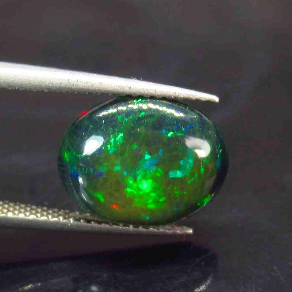 3.16 Ctw Natural Ethiopian Black Fire Opal Oval Cab: Title: 3.16 Ctw Natural Ethiopian Black Fire Opal Oval Cab Stone Clarity: Opaque Gemstones: Black Opal Size/Dimensions: 3.16 Carat Weights: 13.00 x 10.60 x 4.30 mm Additional Information: Excellent Ov