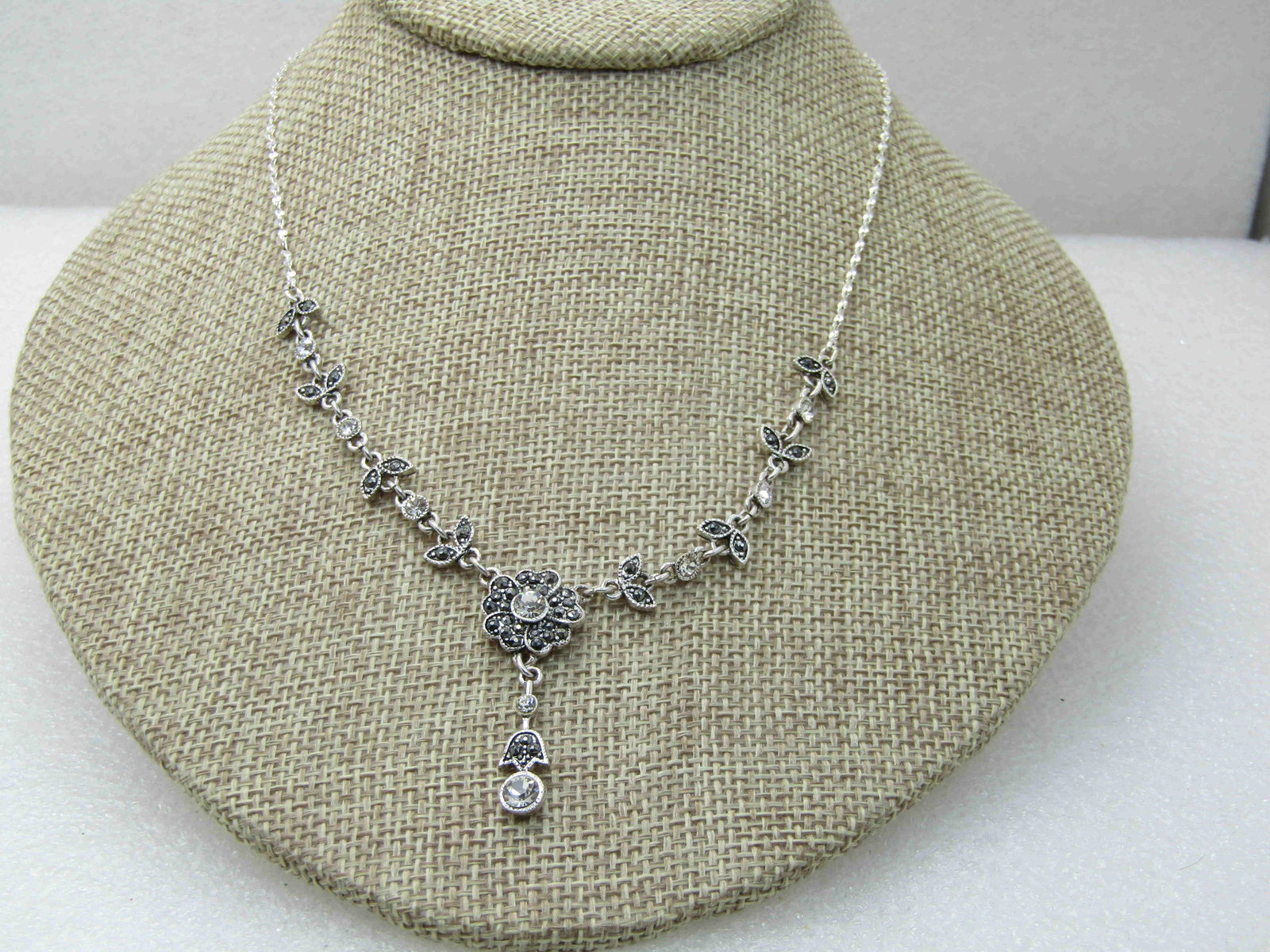 Marcasite & Rhinestone Floral Lavalier Necklace 19.5",: Marcasite & Rhinestone Floral Lavalier Necklace 19.5", Silver Tone, Signed N.R.. The necklace is 17" with a 2.5" extender chin, lobster clsp. Floral and leave design with marcasite and rhinestone acce