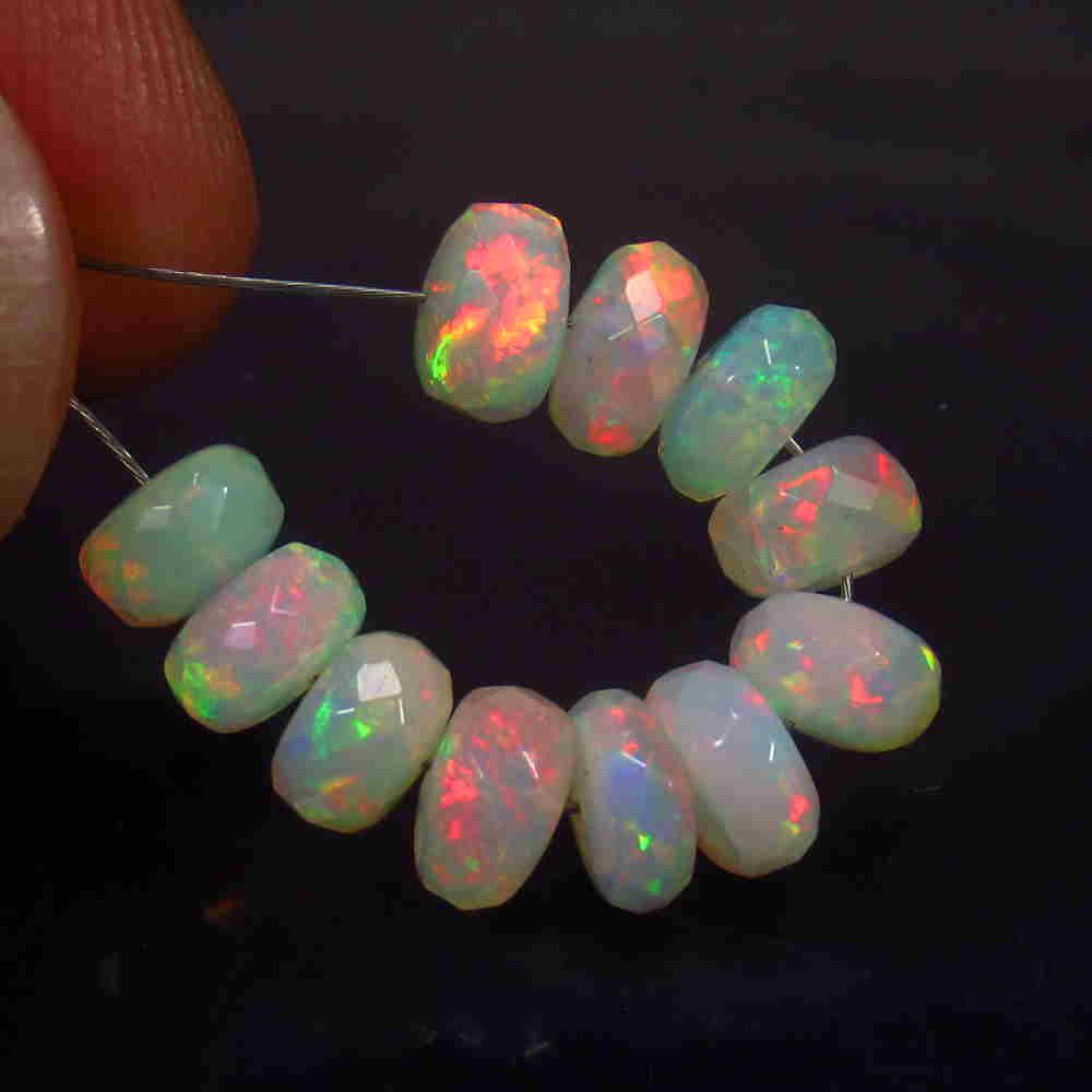 6.50 Ctw Natural 11 Drilled Faceted Fire Opal Beads: No Reserve! Title: 6.50 Ctw Natural 11 Drilled Faceted Fire Opal Beads Stone Clarity: Transparent Gemstone: Faceted Fire Opal Beads Carat Weight: 6.5 Size/Dimensions: 5.50 to 6.10 mm / 11 PC's Additio
