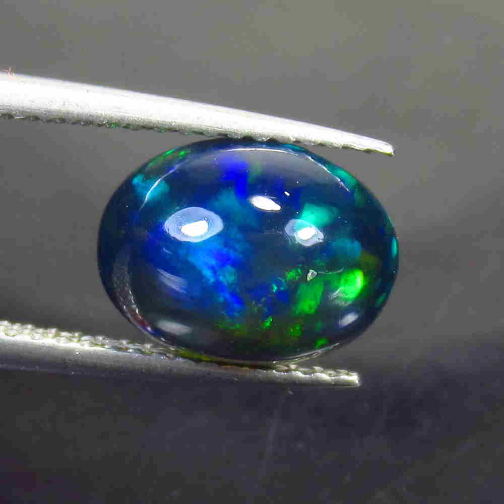 2.00 Ctw Natural Ethiopian Black Fire Opal Oval Cab: No Reserve! Title: 2.00 Ctw Natural Ethiopian Black Fire Opal Oval Cab Stone Clarity: Translucent Gemstone: Black Opal Carat Weight: 2.00 Size/Dimensions: 10.50 x 7.90 x 5.00 mm Additional Information