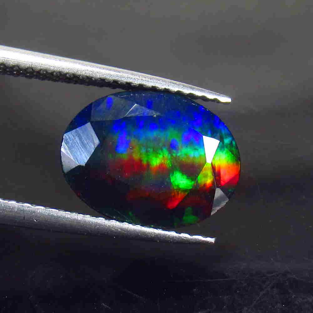 2.27 Ctw Natural Ethiopian Black Fire Opal Oval Cut: No Reserve! Title: 2.27 Ctw Natural Ethiopian Black Fire Opal Oval Cut Stone Clarity: Translucent Gemstone: Black Opal Carat Weight: 2.27 Size/Dimensions: 12.00 x 9.20 x 5.00 mm Additional Information