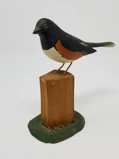 Folky nicely carved bird: Title: Folky nicely carved birdDate: Mid 20th cDimensions: 6 1/2h x 6 1/2"LProvenance/Additional Info: Probably an eastern towhee. Signed J. Watson on base. . . . Wire legs and painted eyes.