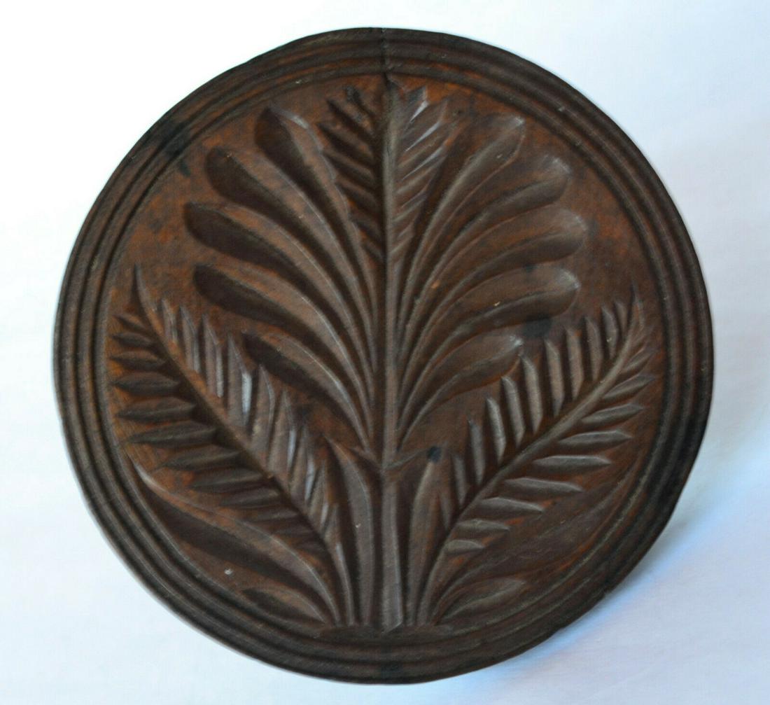 Butter Stamp - Floral: Vintage Early American butter stamp. Lovely old patina, acorn shaped knob handle, unusual and eleaborate floral and leaf motif. No chips, two tight hairlines. Measures about 4 1/8" diameter by 3" tall