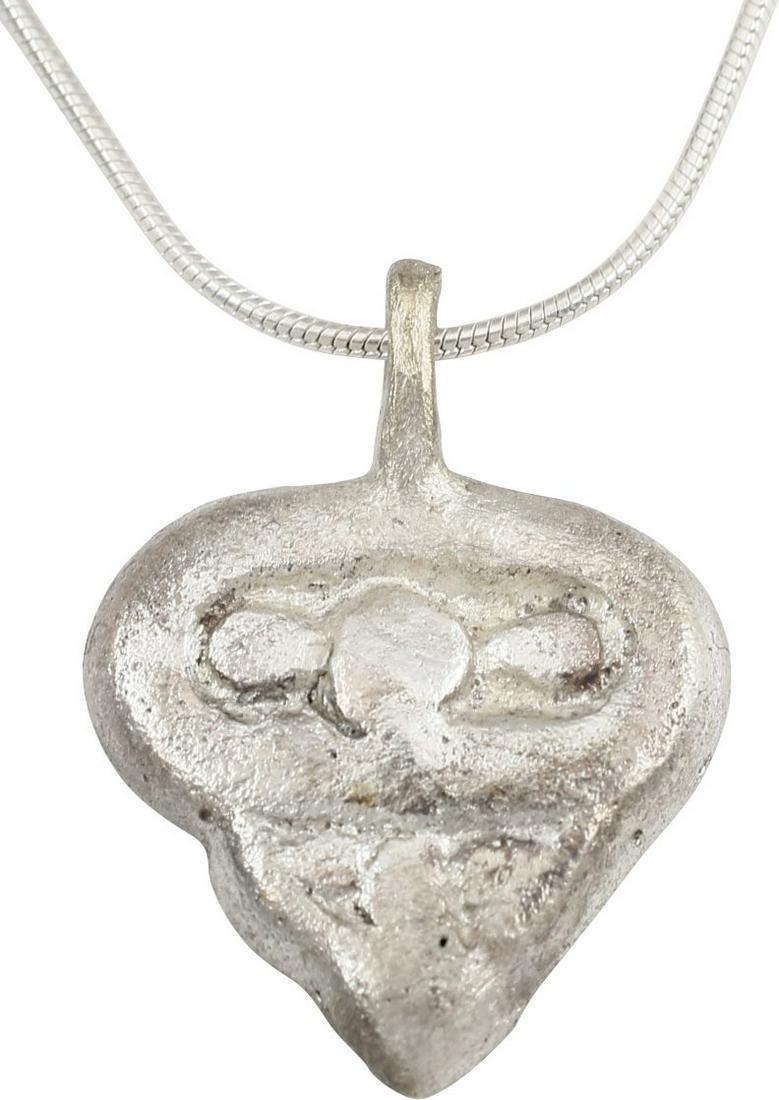 VIKING HEART PENDANT NECKLACE C.900 AD: An early example of a particularly deep form with a hollow back perhaps intended to contain sacred material. broad border with trefoil top motif and a smaller trefoil forming the point. Excellent exam