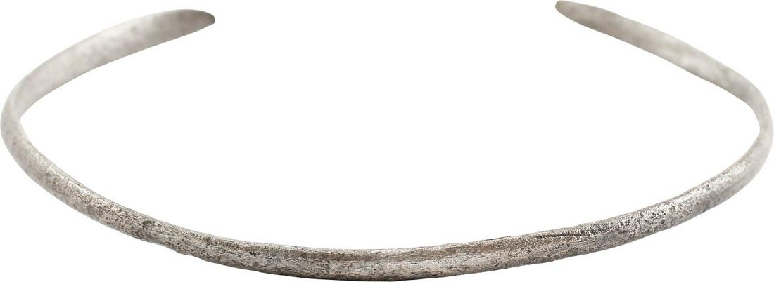 VIKING WOMAN: 2 7/4" inside dimension which comfortably fits an average woman. C form, nearly round, slightly tapered from its center to the ends which are of flatter spatulate form, probably representing serpents.