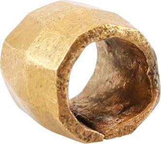 VIKING GILT BEAD, 9TH-11TH CENTURY AD.: 6.2mm length, just under 1/4". Hand formed from bronze, forged to hexagonal section with the center swelled to a ridge. Butted seam. Professionally refurbished with the 24karat gold overlay restored. 