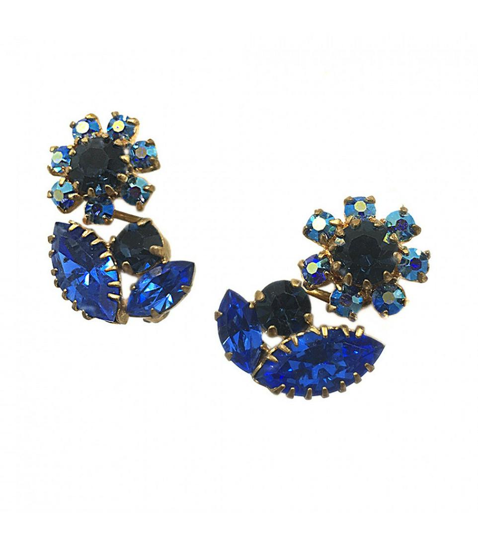 Austria Blue Flower Earrings: Overview Signed vintage costume jewelry from 1940-50s Materials: Rhinestone, Metal Austrian antiqued gold metal flower clip back earrings with prong-set three shades of blue rhinestones. Dimensions: 0