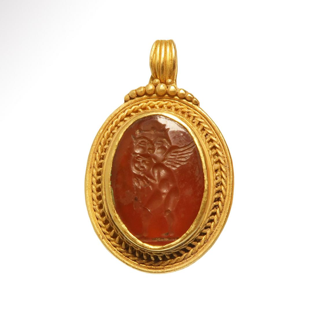Gold Pendant with Cornelian Intaglio with Two Gorgons: Title: Gold Pendant with Cornelian Intaglio with Two Gorgons Date/Origin: Roman, c. 1st Century A.D. Description: Fine frame worked with granules and rope patterns, wide suspension loop and set with a