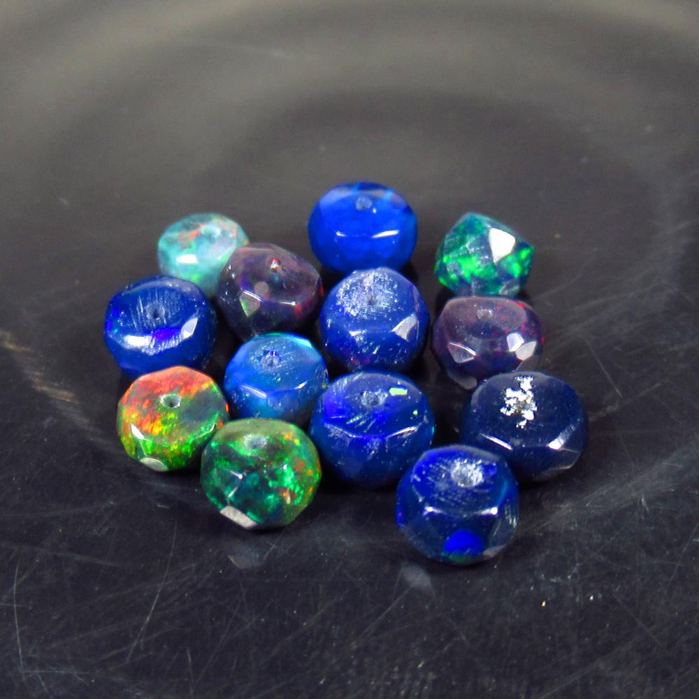 5.29 Ct Natural 13 Drilled Faceted Black Opal Beads: No Reserve! Title: 5.29 Ct Natural 13 Drilled Faceted Black Opal Beads Stone Clarity: Translucent Gemstone: Natural Faceted Black Opal Beads Carat Weight: 5.29 Dimensions: 4.80 to 5.30 mm / 13 PC's Ad