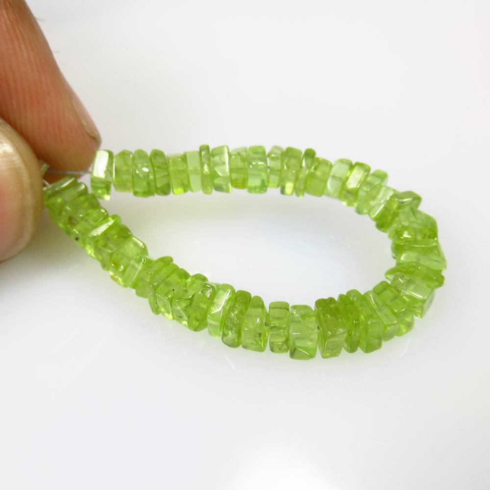 15.60 Ct Natural 48 Drilled Peridot Square Beads: No Reserve! Title: 15.60 Ct Natural 48 Drilled Peridot Square Beads Stone Clarity: Transparent Gemstone: Natural Peridot Beads Carat Weight: 15.60 Dimensions: 3.6x3.6 to 4.1x4.1 mm / 48 PC's Additiona
