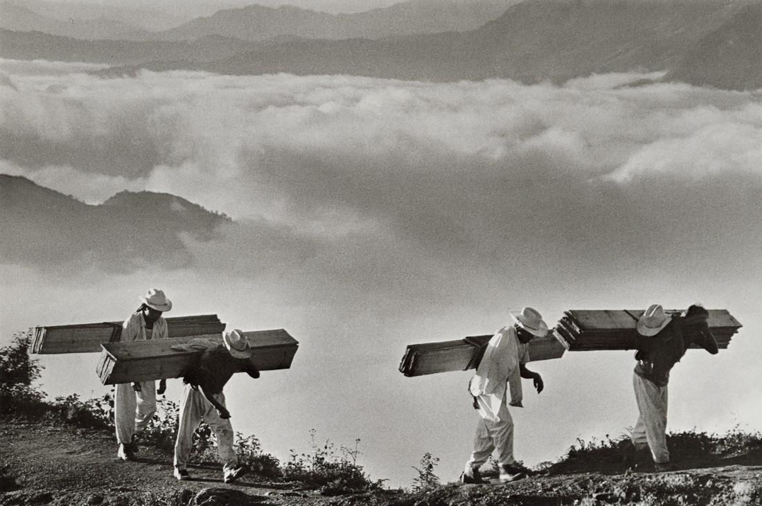 SEBASTIAO SALGADO - Wood Delivery Men, Mexico, 1980: Artist: Sebastiao Salgado Title: Wood Delivery Men for the Villages of the Eastern Sierra Madre, Mexico, 1980 Medium: Photo Litho, 1999, Italy Dimensions: 9x6" Description: Heat Wax Mounted on 8.5x11"