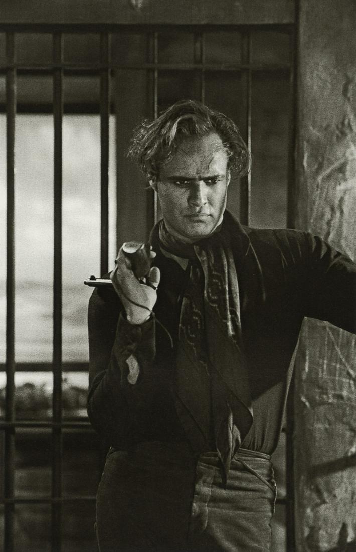 SAM SHAW - Marlon Brando, "One Eyed Jacks", 1958: Artist: Sam Shaw Title: Marlon Brando, "One Eyed Jacks", Monterey, California, 1958 Medium: Photo Litho, 2004, Italy Dimensions: 5.35x8.25" Description: Heat Wax Mounted on 8.5x11" Conservation Board